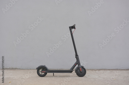 Teenage girl circulating with an electric scooter