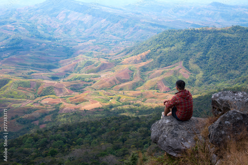 A man enjoy with beautiful view on the top of mountain 