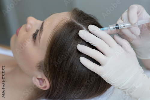 treatment of hair loss, injection for hair growth. Injected in woman's head, hair mesotherapy