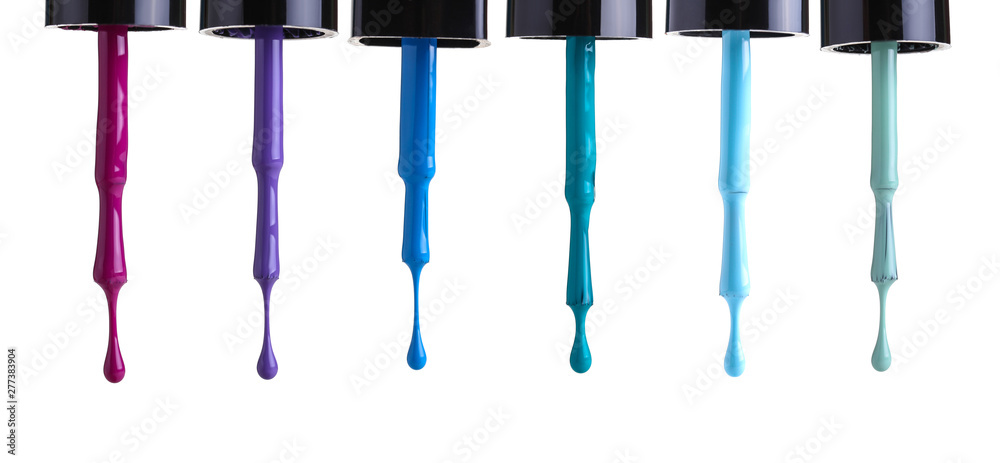 Nail polish brushes on white background