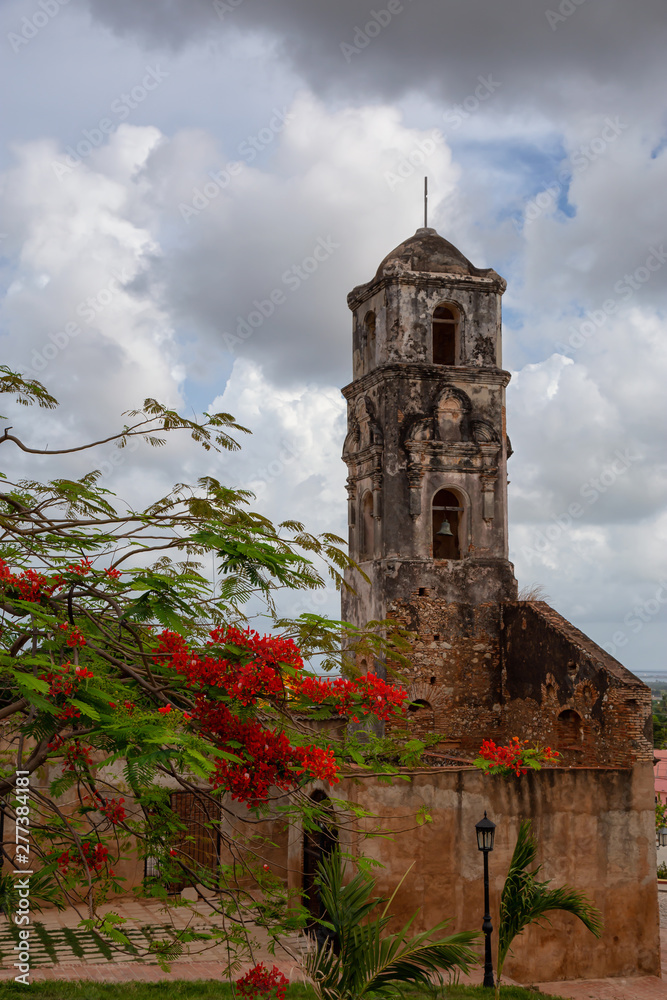 Beautiful View of a Church in a small touristic Cuban Town during a vibrant sunny and cloudy day. Taken in Trinidad, Cuba.