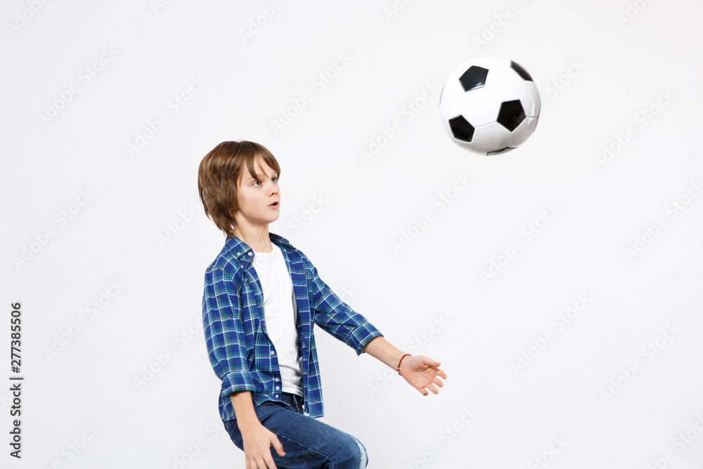 Fototapeta premium Football fan kid boy in blue t-shirt cheer up support favorite team with soccer ball isolated white wall background children studio portrait. People childhood sport family leisure lifestyle concept.