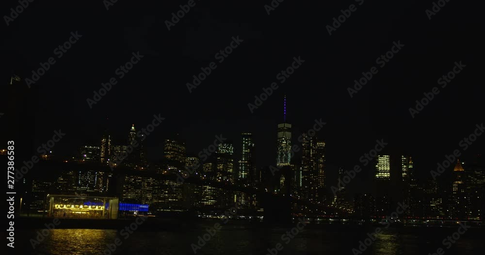 Impressive Shot of Famous Iconic New York Skyline And Brooklyn Bridge At Night With The Infamous Empire State Building In New York Impressive Shot of Famous Iconic New York Skyline And Brooklyn Bridge At Night With The Infamous Empire State Building In New York