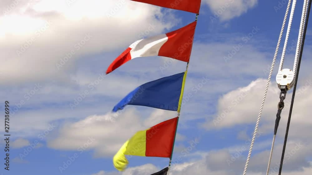 Pennants and flags of Kruzenshtern a four-masted barque moored to the quays of the Garonne River during the 