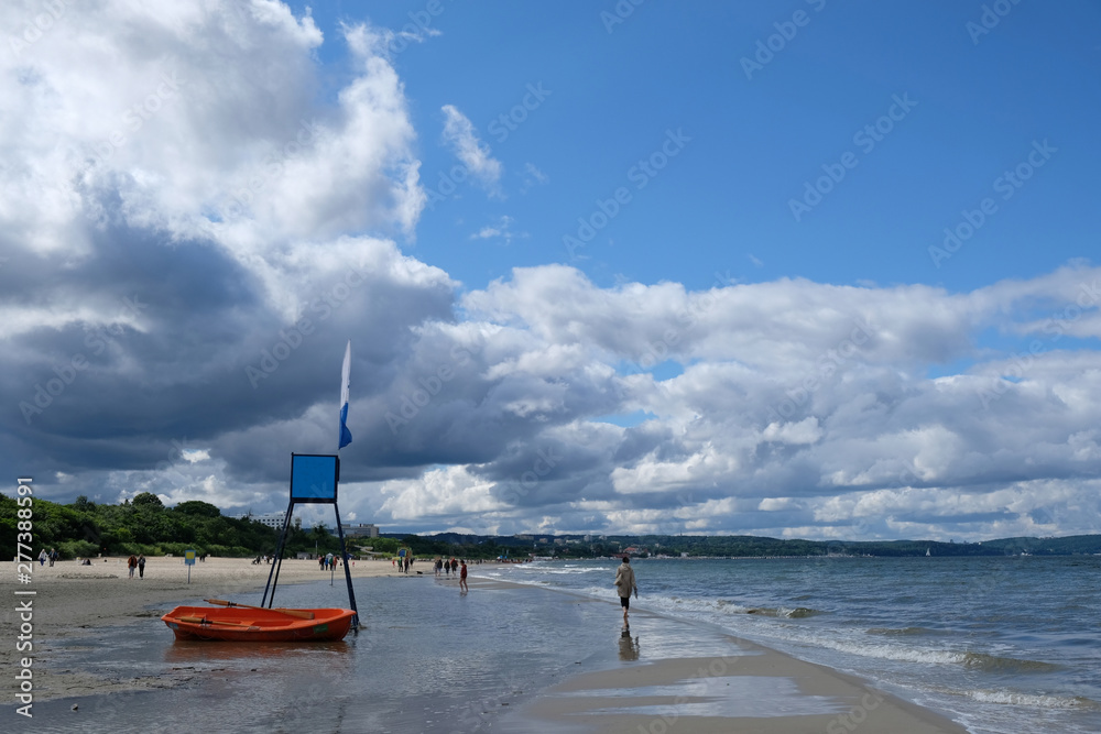 Poland, Gdansk, Baltic Sea - tower for rescuers on Jelitkowo beach in cloudy day with amazing dramatic clouds