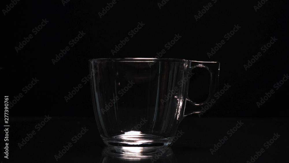 The Process Of Brewing Tea. Tea Ceremony, A Cup Of Freshly Briar, A Dark Mood. Hot Water Is Poured with steam. Concept of: Hot, Steam, Ceramic, Mug. The Process Of Brewing Tea. Tea Ceremony, A Cup Of Freshly Briar, A Dark Mood. Hot Water Is Poured with steam. Concept of: Hot, Steam, Ceramic, Mug.