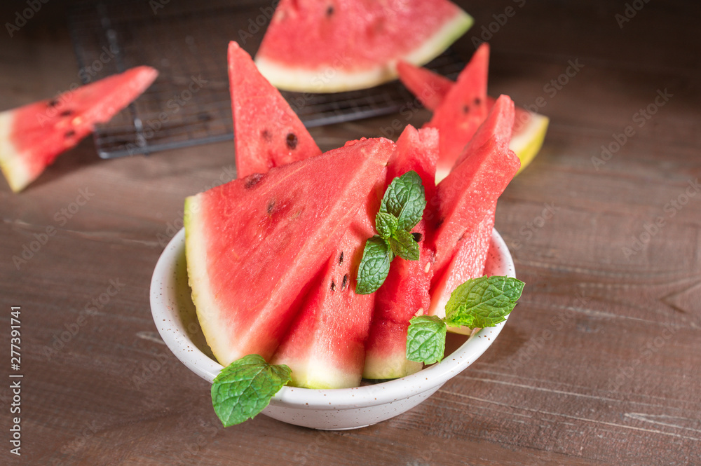 Tasty sliced watermelon on wooden table Tasty sliced watermelon on wooden table