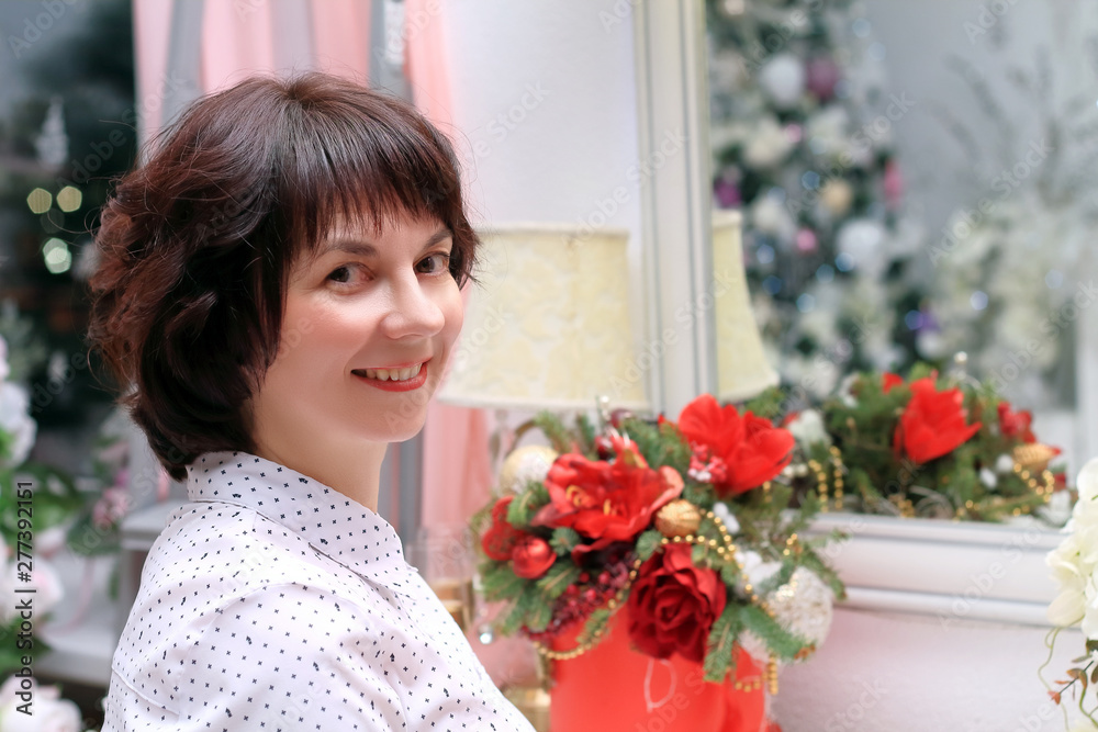 woman at the christmas tree