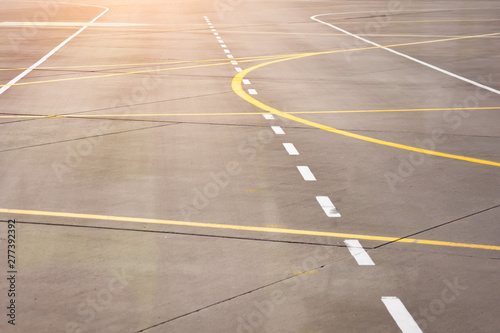 Marking for ground transportation on the airport apron among taxiways.