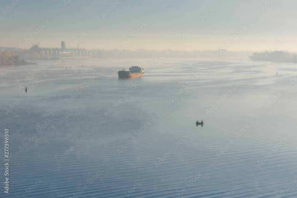Cargo ship in fog on a river Dnieper Cargo ship in fog on a river Dnieper