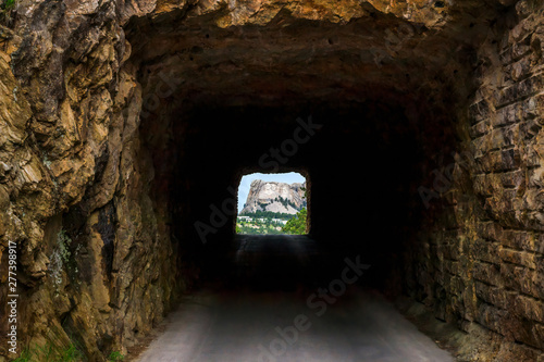 Mount Rushmore framed by tunnel on Iron Mountain Road in the Black Hills of South Dakota, USA photo