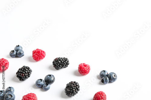 Flat lay composition with berries on white background  space for text