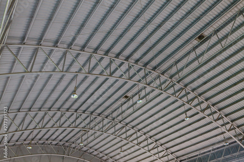 Steel roof structure. Moonlight bulb. Steel structure with roof tiles. Architectural structure of roof. Large roof layout used for industrial plants.