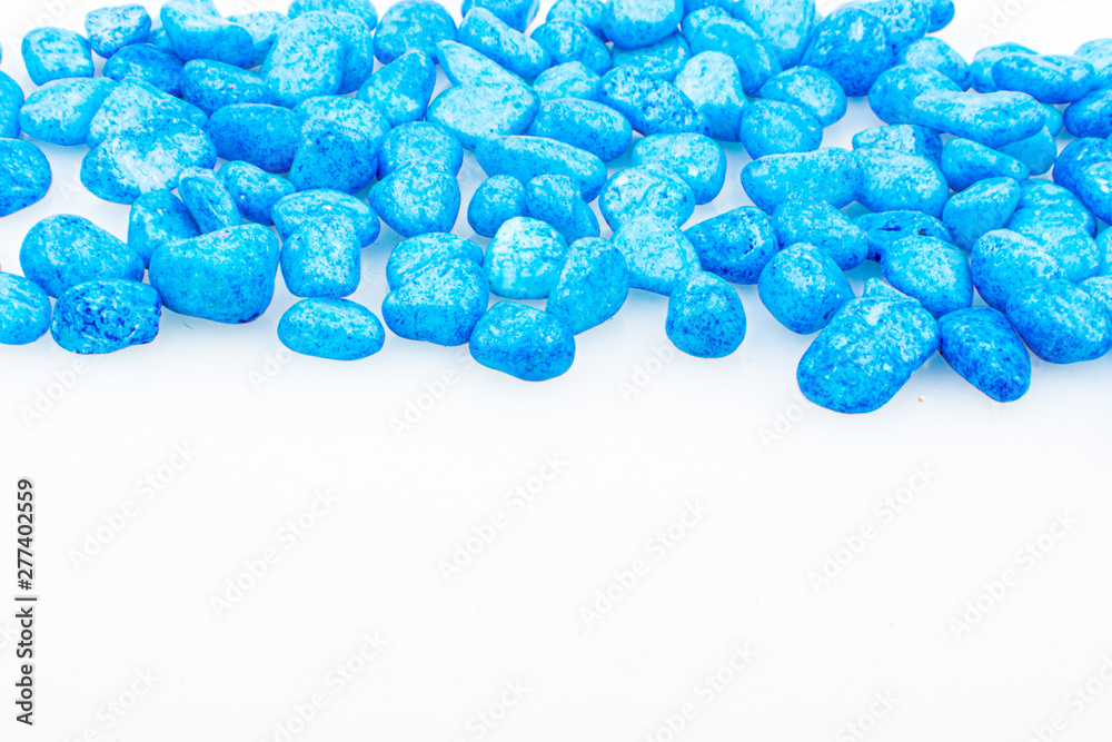 Blue pebbles stone with empty copyspace area for slogan or advertising text message, over isolated white background. Blue pebbles stone with empty copyspace area for slogan or advertising text message, over isolated white background.