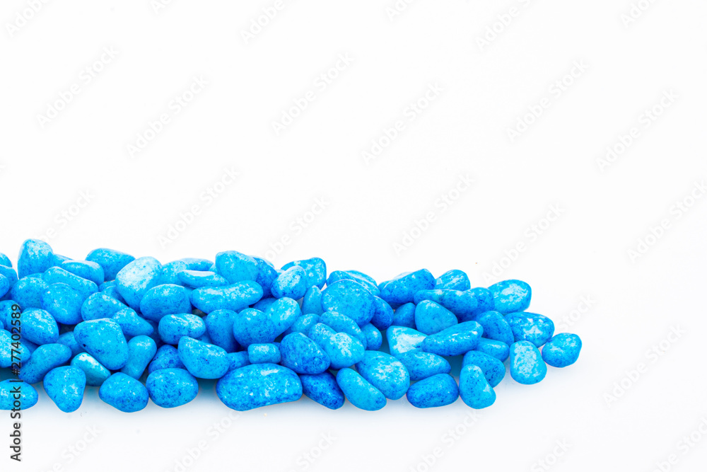Blue pebbles stone with empty copyspace area for slogan or advertising text message, over isolated white background. Blue pebbles stone with empty copyspace area for slogan or advertising text message, over isolated white background.
