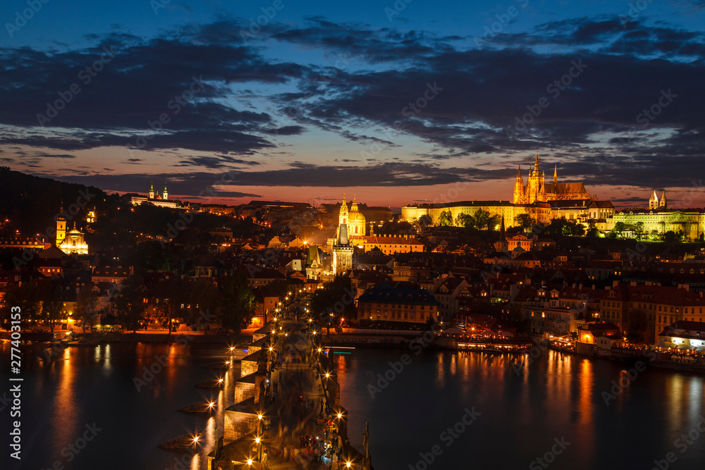 Top view of Prague castle, St. Vitus Cathedral, Vltava river and Charles bridge at night. Prague, Czech Republic