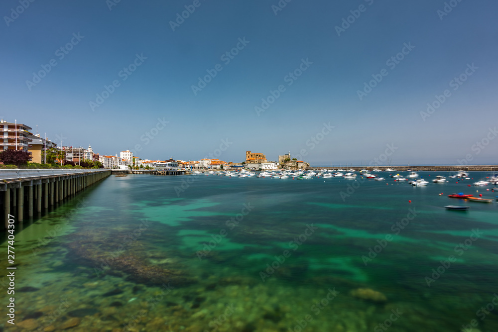 Castro Urdiales marina ultra long exposure with many boats and clear water