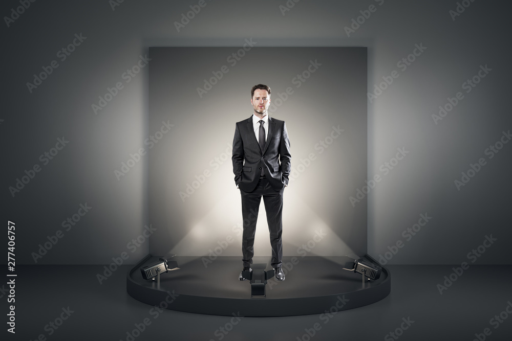 Fototapeta premium Attractive businessman on podium