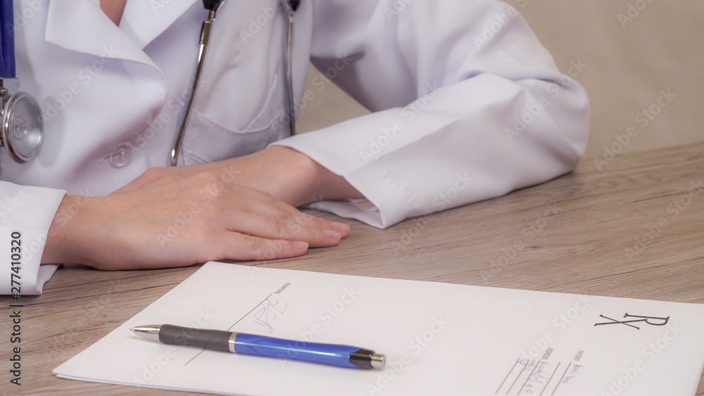 The doctor puts his signature in the recipe. Slow panorama from right to left The doctor puts his signature in the recipe. Slow panorama from right to left