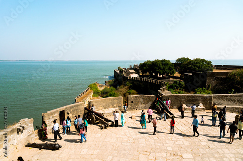 The old lighthouse on the famous tourist spot of fort diu in gujarat, overlooking the arabian sea photo