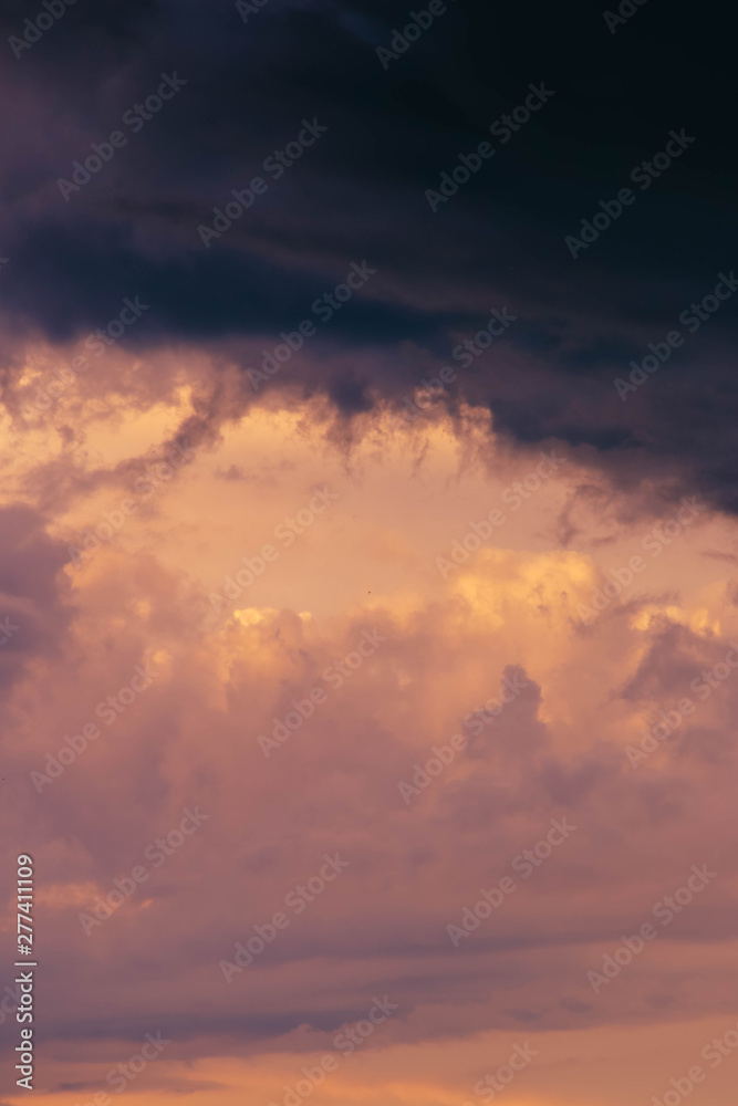 dark blue clouds on pink from sunset sky