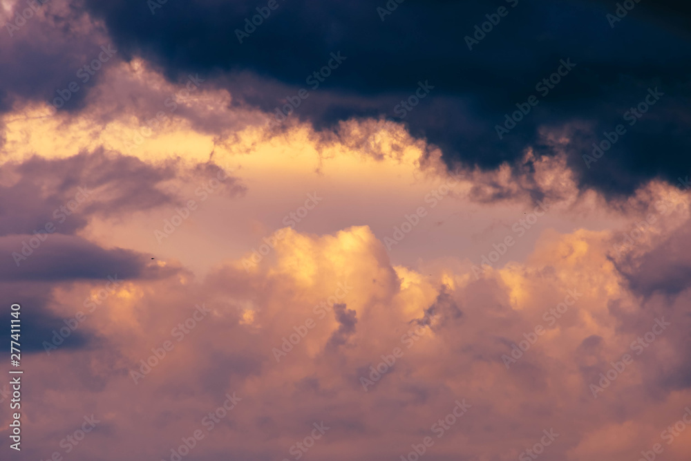 dark blue clouds on pink from sunset sky