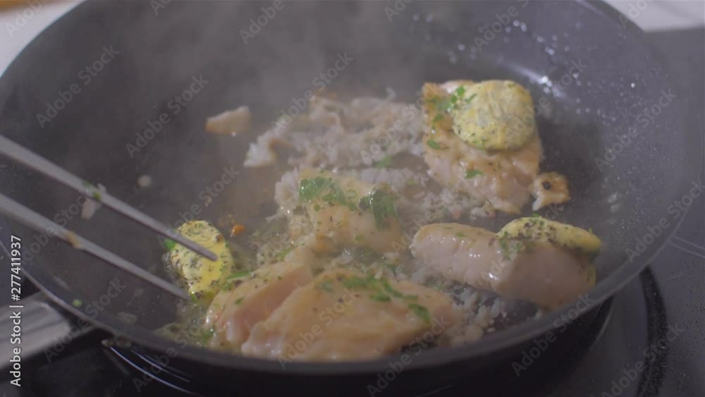 Raw fish fillets fried in a pan with butter Raw fish fillets fried in a pan with butter