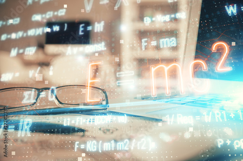 Formulas drawing with glasses on the table background. Concept of science. Double exposure.