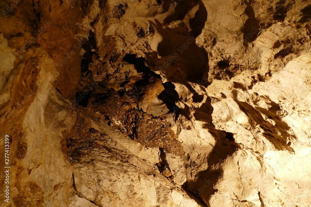 Fototapeta premium nice cave with sunet light and colorful structures
