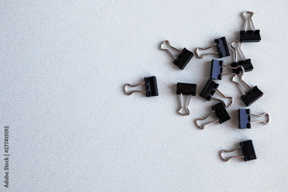 Metal office clips scattered on a white background Metal office clips scattered on a white background
