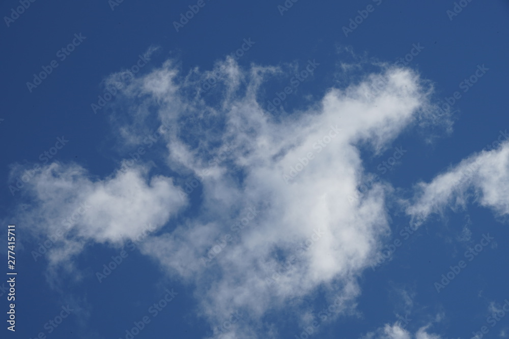 Large White High Depth and Detail Clouds on Brilliant Blue Sky Large White High Depth and Detail Clouds on Brilliant Blue Sky