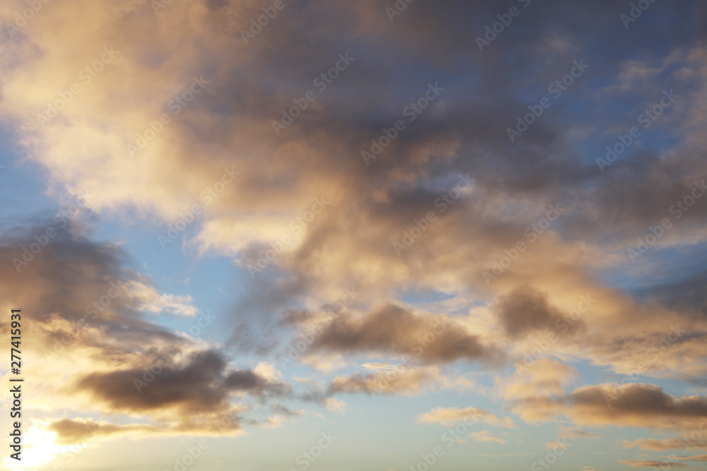 Sunlit clouds in sky