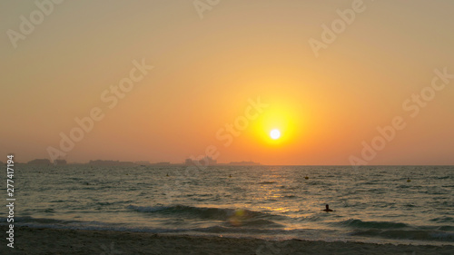 The sun sets over the horizon on the beach, Time lapse 4k © vadosloginov