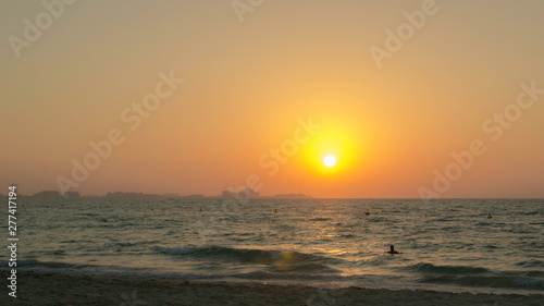 The sun sets over the horizon on the beach, Time lapse 4k photo