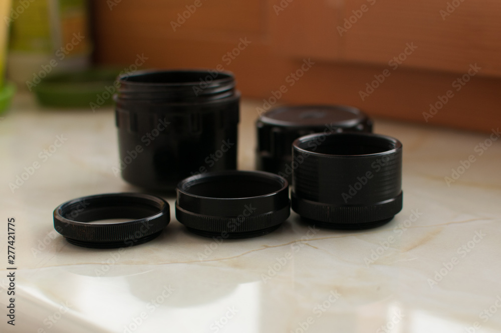 Black old macro lenses on the windowsill Black old macro lenses on the windowsill