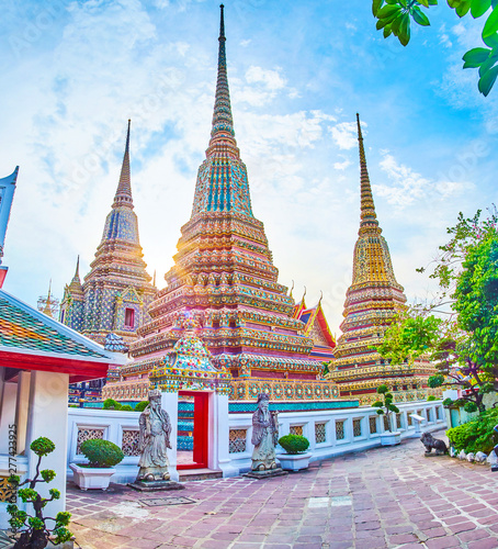 The pagodas of Wat Pho in the evening light, Bangkok, Thailand photo