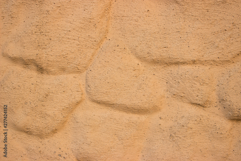 Decorative masonry painted in light brown