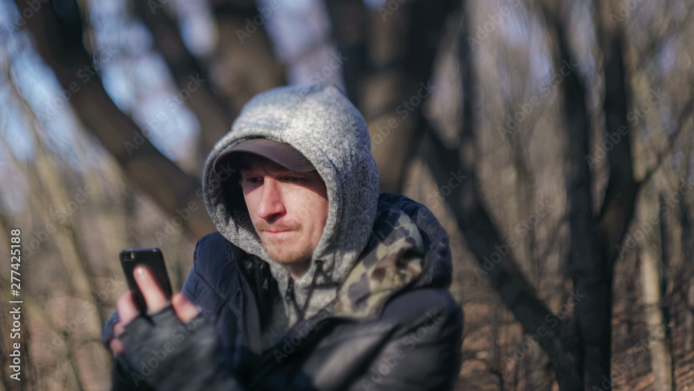 A man in a cap with the phone UHD video A man in a cap with the phone UHD video