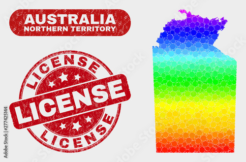 Spectral dotted Australian Northern Territory map and stamps. Red round License grunge stamp. Gradient spectral Australian Northern Territory map mosaic of randomized round elements.