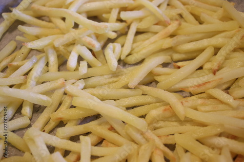 French fries. Hot fresh french fries background. French fried potato slices.