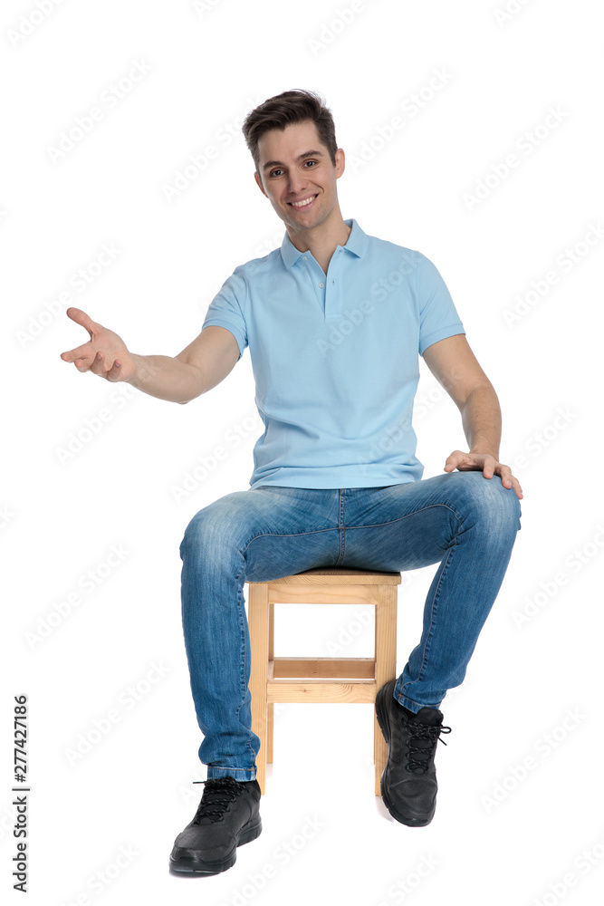 Joyful casual guy greeting and smiling Joyful casual guy greeting and smiling
