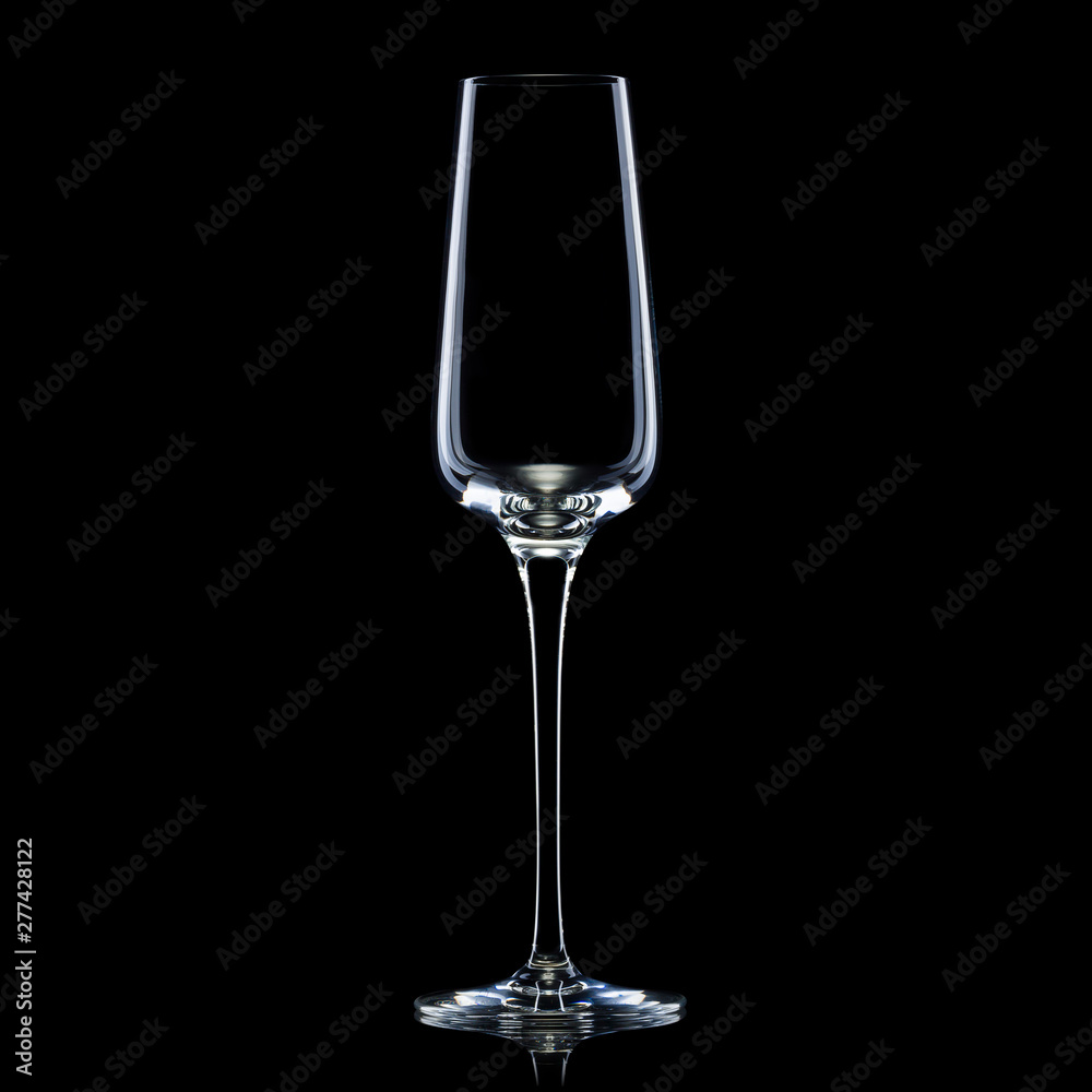 Empty luxury champagne glass isolated on a black background