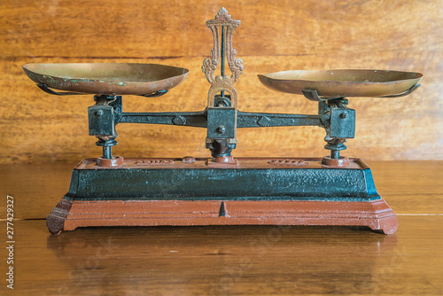 Vintage bascule on the old wooden background