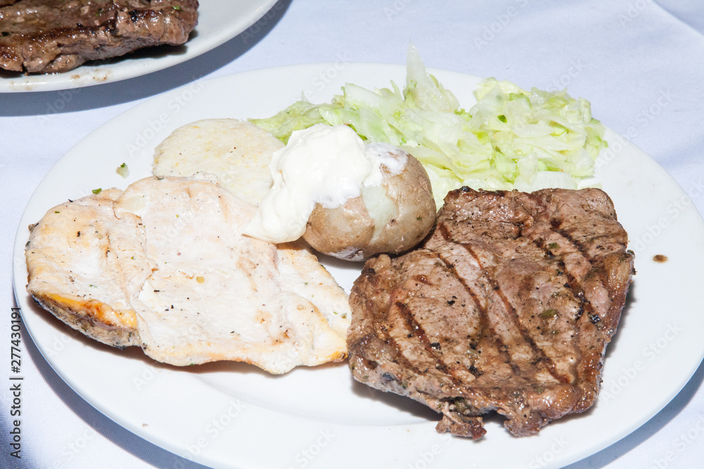 serving of grilled meat served on the table serving of grilled meat served on the table