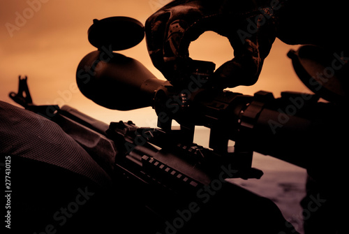Cuadro en lienzo Automatic hunting rifle with optical scope close-up, sight adjustment when shoot