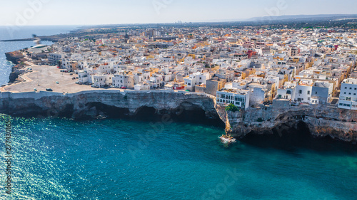 Aerial view of the beach lama monachile cala porto in the italian city polignano a mare.  photo