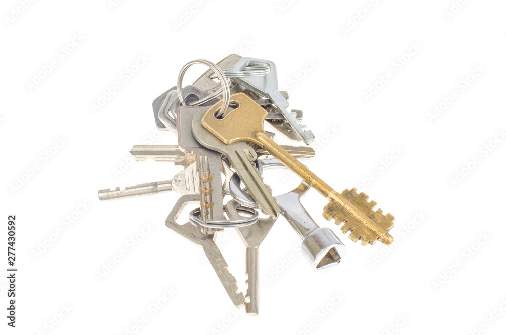 Bundles of old keys on white background. Bundles of old keys on white background.
