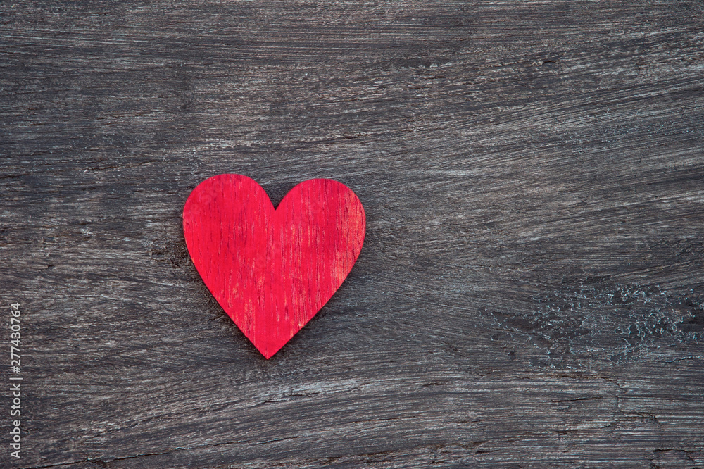 Red heart on wooden table, top view. With space for text. Concept of help