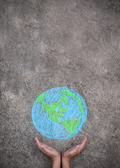 Closeup hands holding earth draw with chalk. World harmony green peace environment earth day together concept.