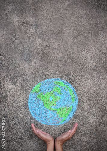 Fototapeta Naklejka Na Ścianę i Meble -  Closeup hands holding earth draw with chalk. World harmony green peace environment earth day together concept.